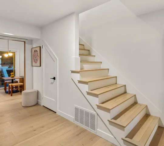 a front view of a house with a yard and a garage