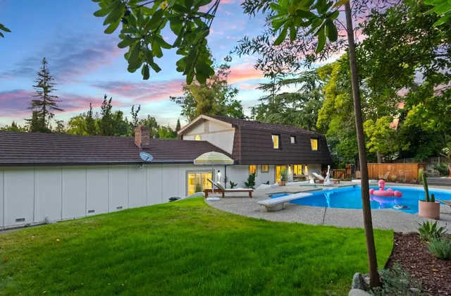 a kitchen with stainless steel appliances granite countertop a stove and a sink