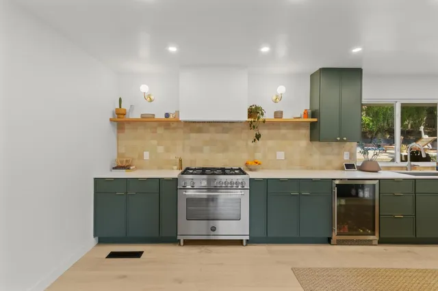 a living room with furniture a window and a dining table