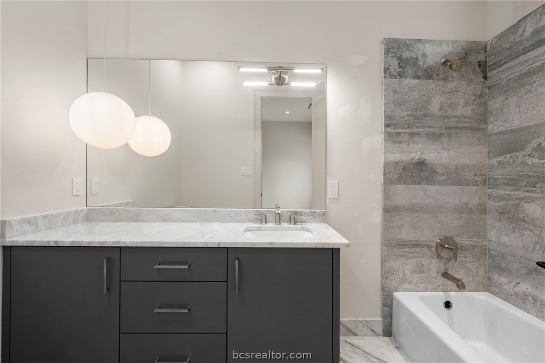 4212 Tuscany Court Bryan, TX 77802 - Photo 26 of 41 a bathroom with a sink and a mirror
