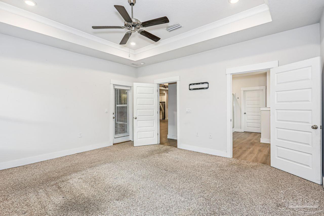5665 Blake Lane Pace, FL 32571 - Photo 23 of 44 a view of empty room with ceiling fan