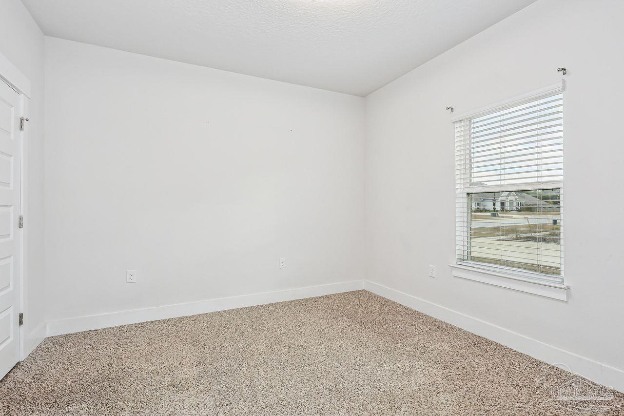 5665 Blake Lane Pace, FL 32571 - Photo 29 of 44 an empty room with windows