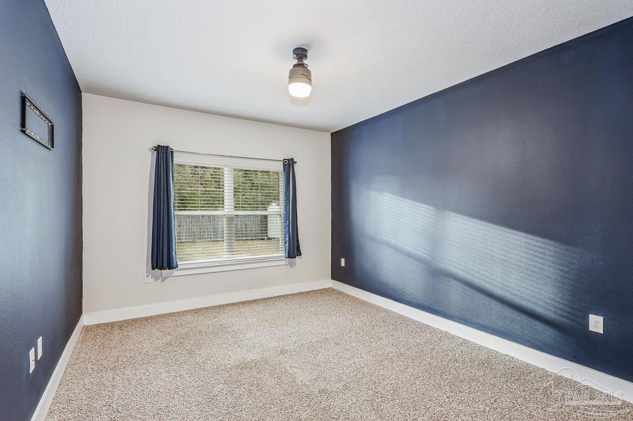 5665 Blake Lane Pace, FL 32571 - Photo 34 of 44 a view of an empty room with a window