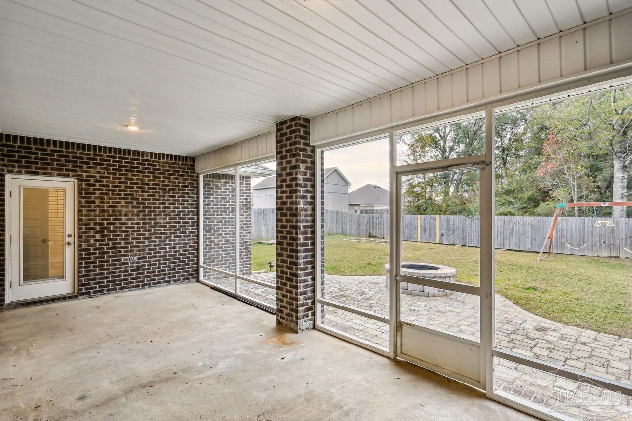 5665 Blake Lane Pace, FL 32571 - Photo 37 of 44 a view of a room with sliding door and wooden roof