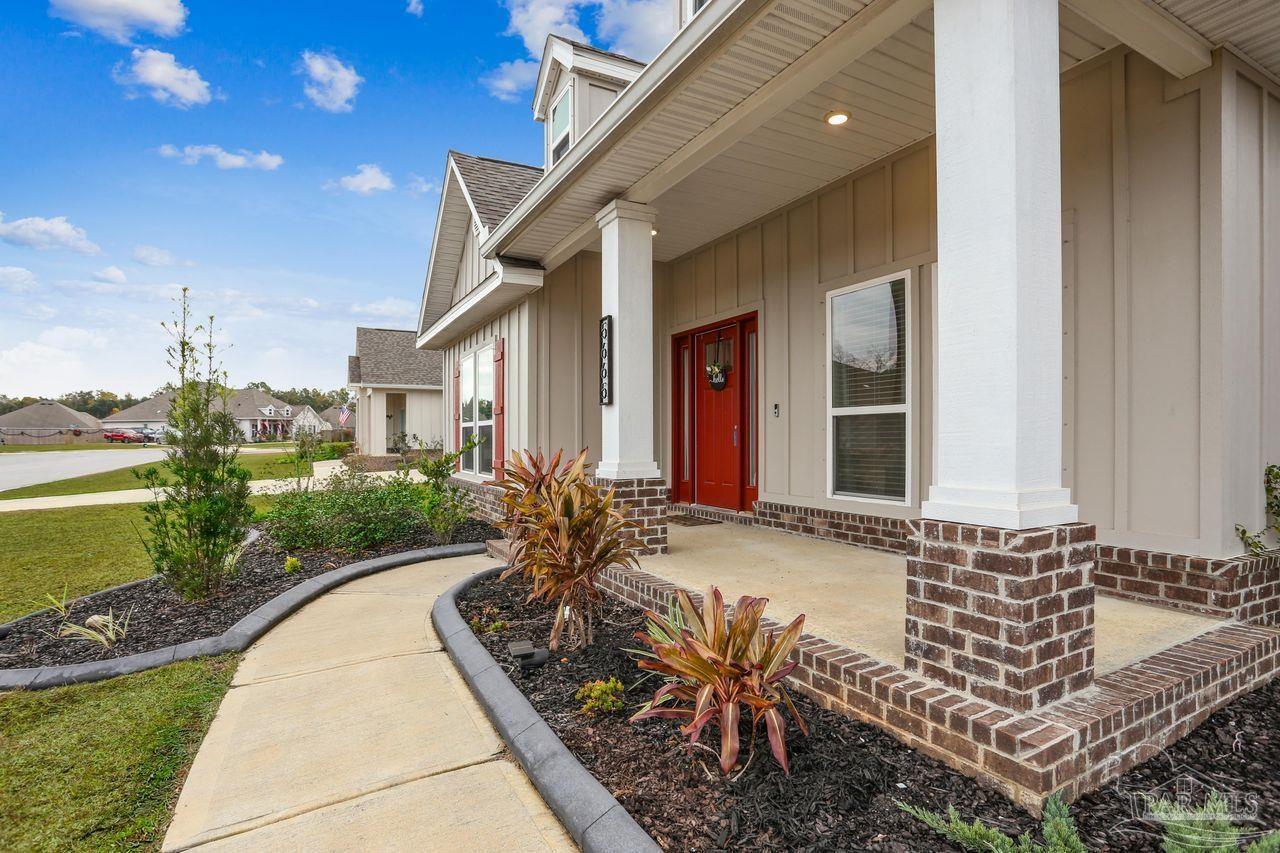 5665 Blake Lane Pace, FL 32571 - Photo 6 of 44 a house view with a outdoor space