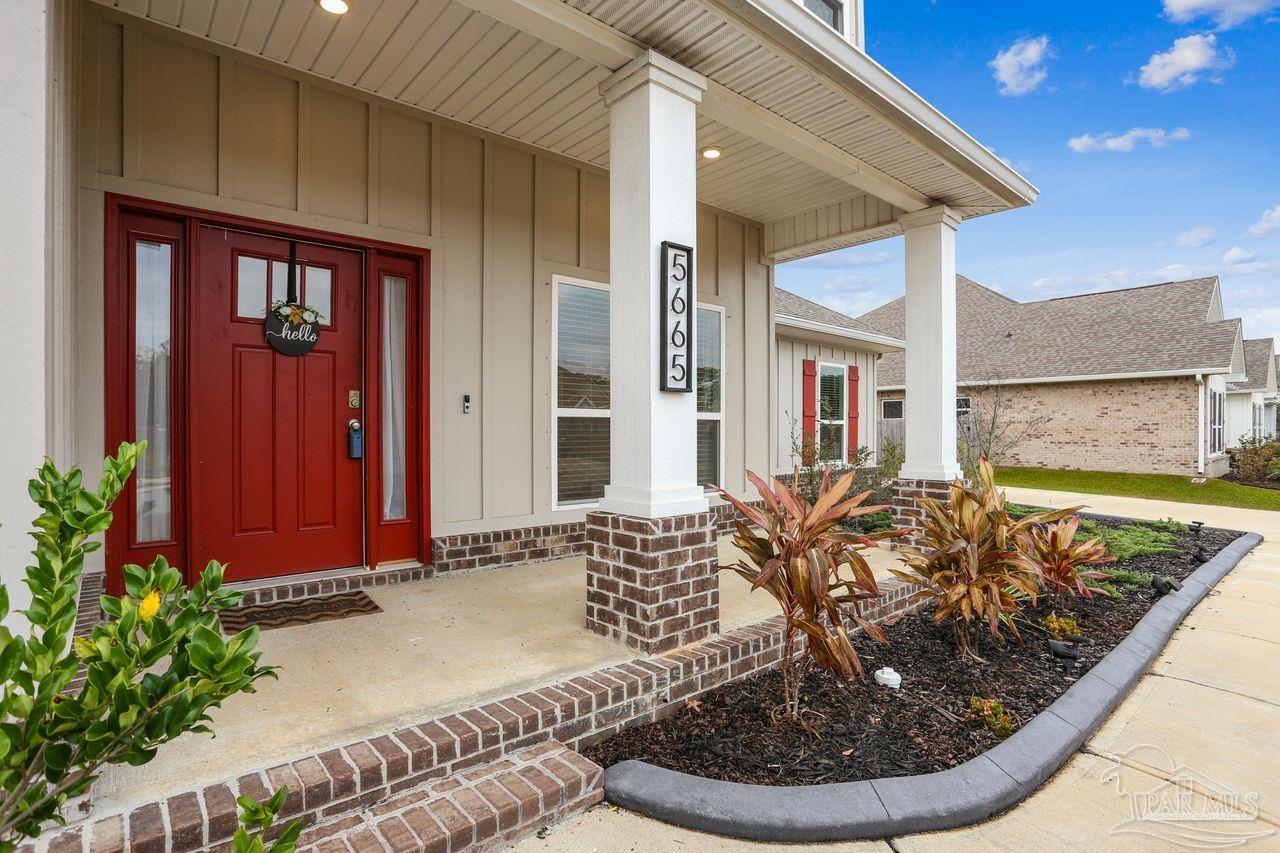5665 Blake Lane Pace, FL 32571 - Photo 7 of 44 a view of a house with entryway