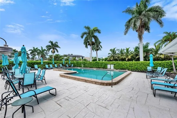 a view of a swimming pool and lounge chair