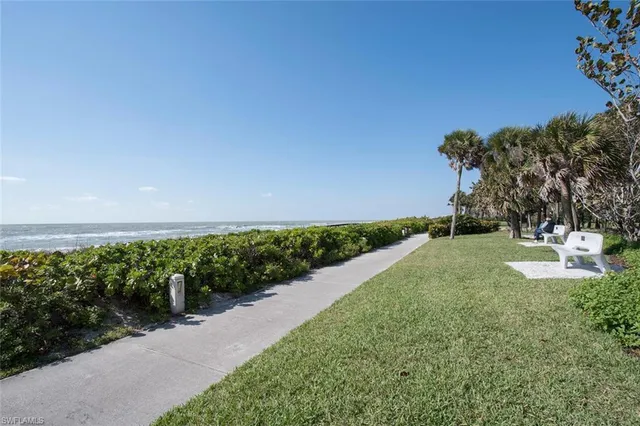 a view of a garden with a building in the background