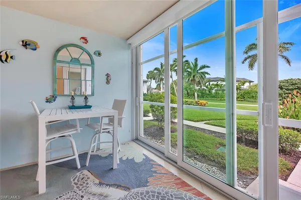 a dining room with a table and chairs