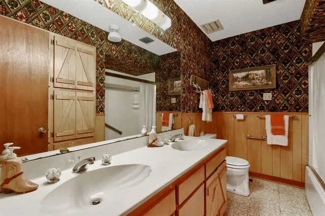 a view of a livingroom with furniture and staircase