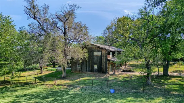 a view of a swimming pool with a yard