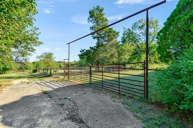 a swimming pool with an outdoor space and seating area