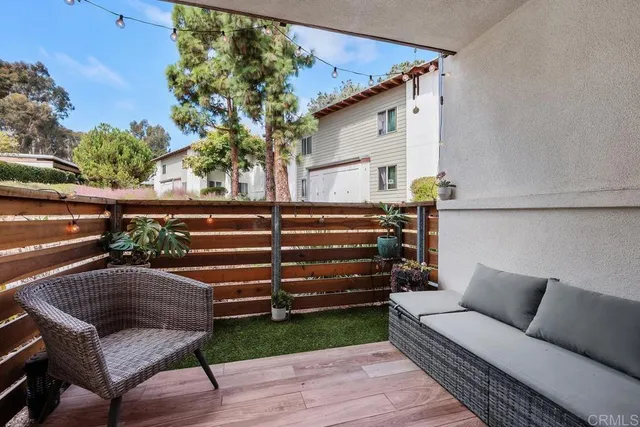 an aerial view of residential houses with outdoor space and swimming pool