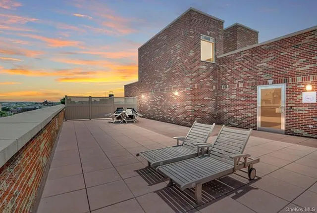 a view of roof deck with patio