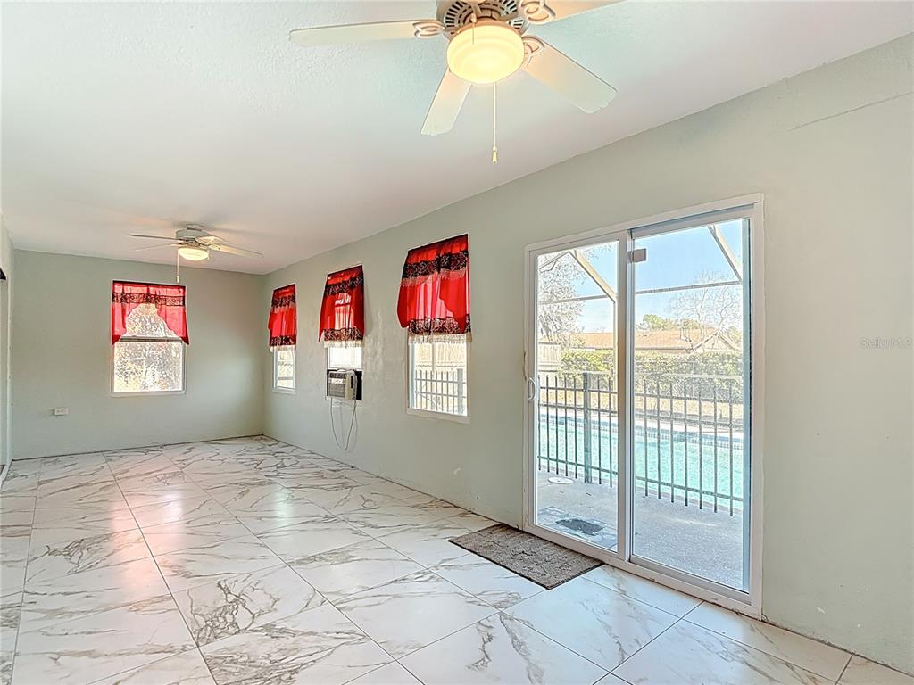 5066 Woodbine Street Spring Hill, FL 34608 - Photo 23 of 59 a view of an empty room with a window