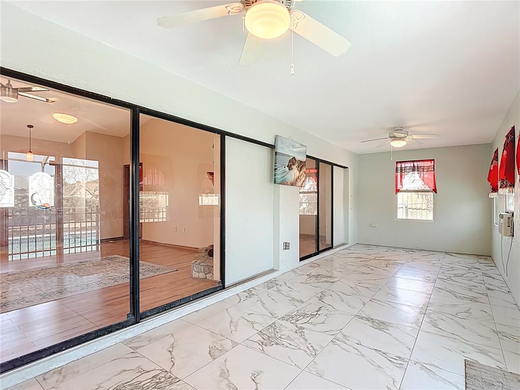 5066 Woodbine Street Spring Hill, FL 34608 - Photo 24 of 59 a view of a big room with windows and closet