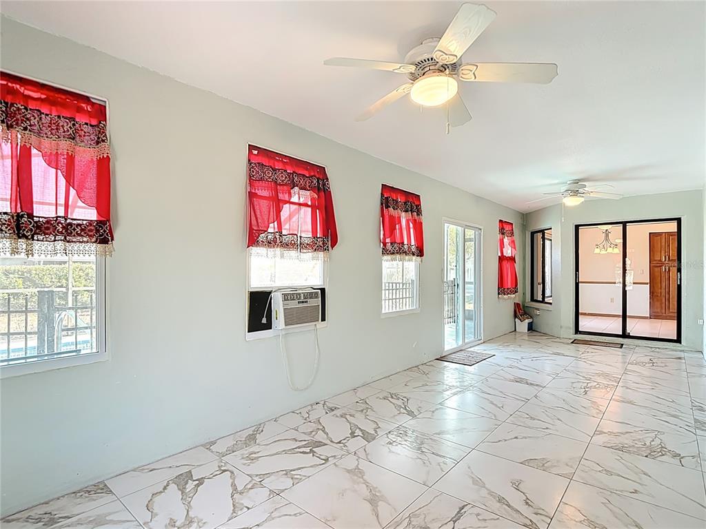 5066 Woodbine Street Spring Hill, FL 34608 - Photo 26 of 59 a view of a livingroom with a window