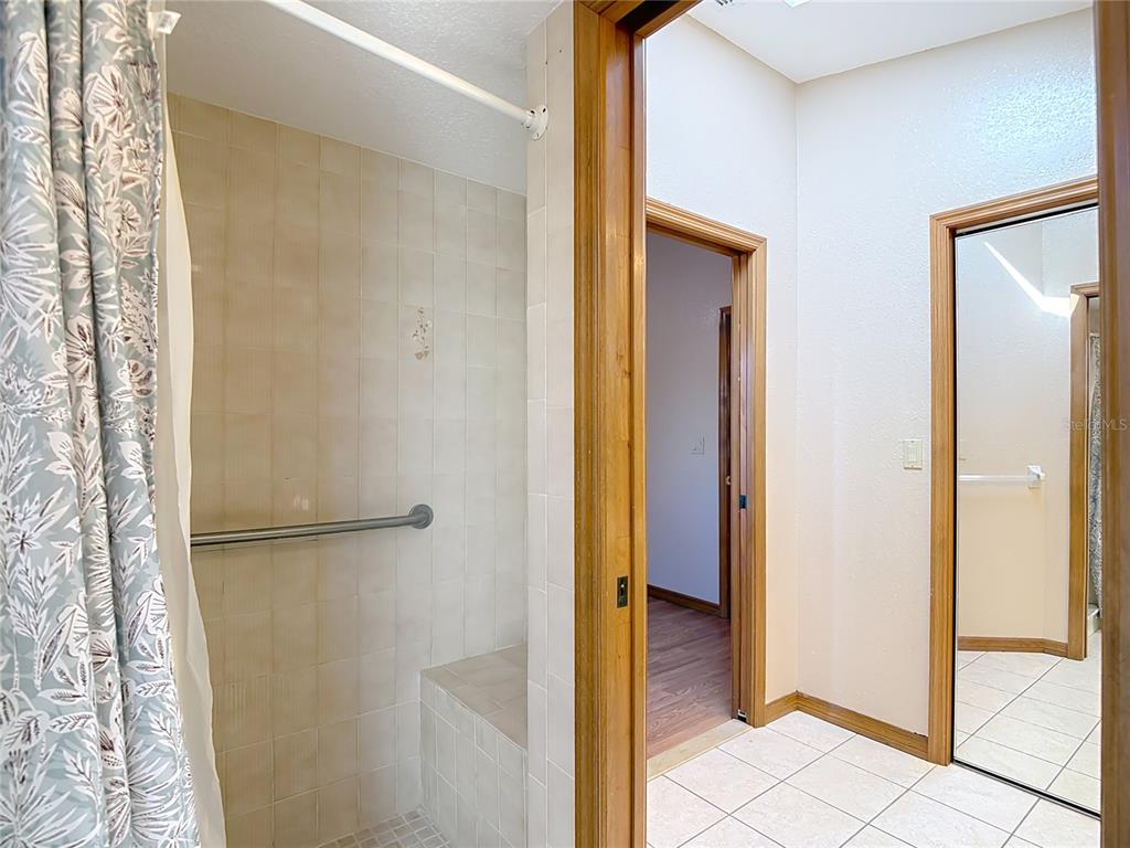 5066 Woodbine Street Spring Hill, FL 34608 - Photo 38 of 59 a view of a bathroom with a shower and a sink