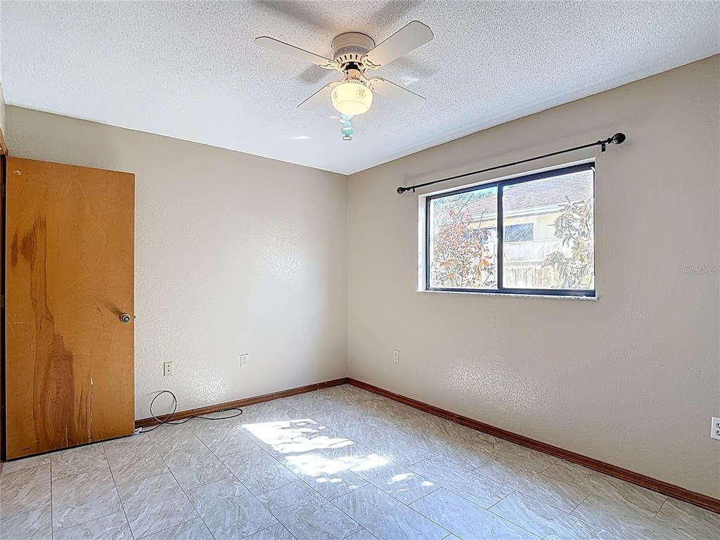 5066 Woodbine Street Spring Hill, FL 34608 - Photo 45 of 59 a view of an empty room with a window