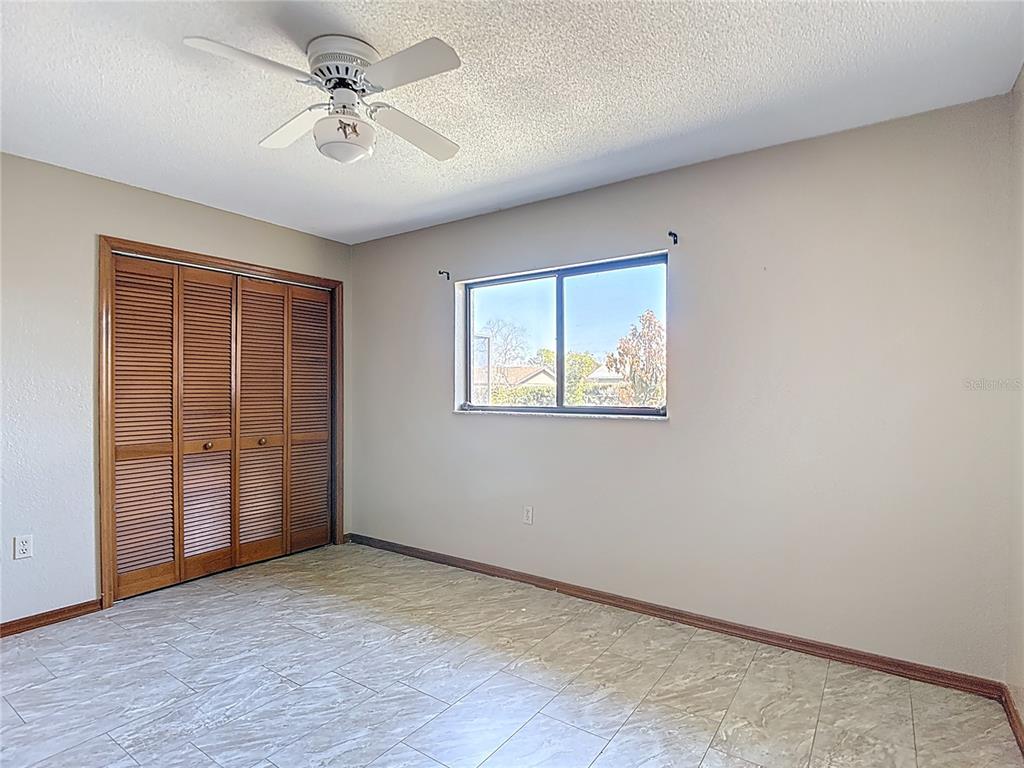 5066 Woodbine Street Spring Hill, FL 34608 - Photo 48 of 59 a view of an empty room with a window