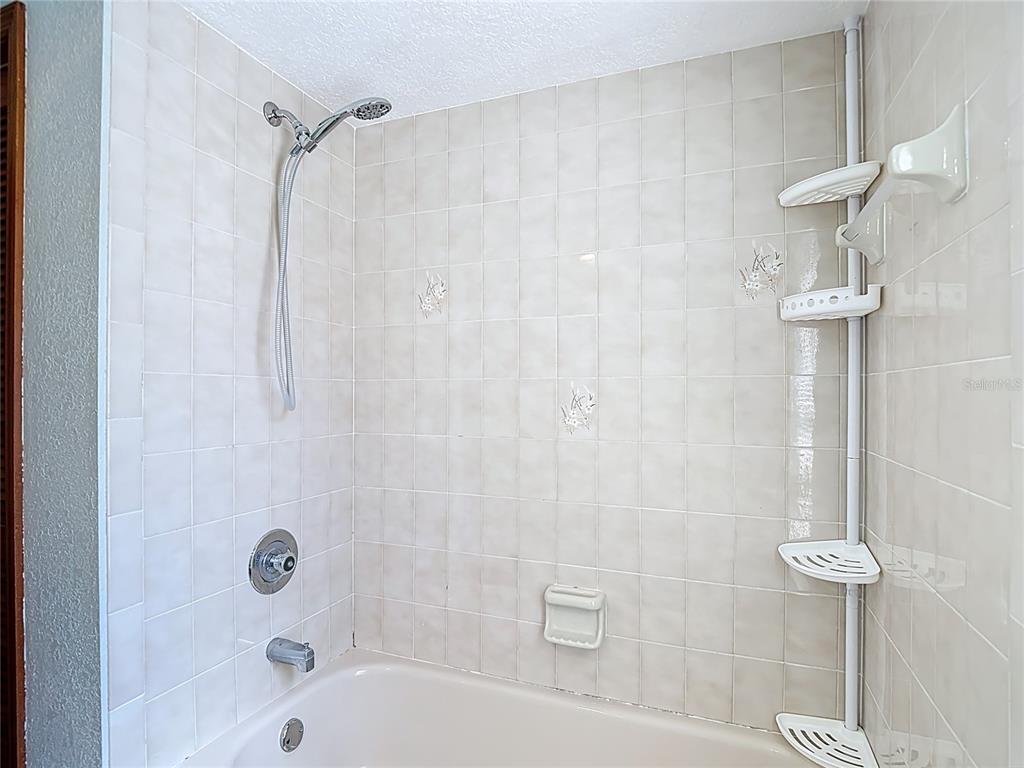 5066 Woodbine Street Spring Hill, FL 34608 - Photo 52 of 59 a bathroom with a shower