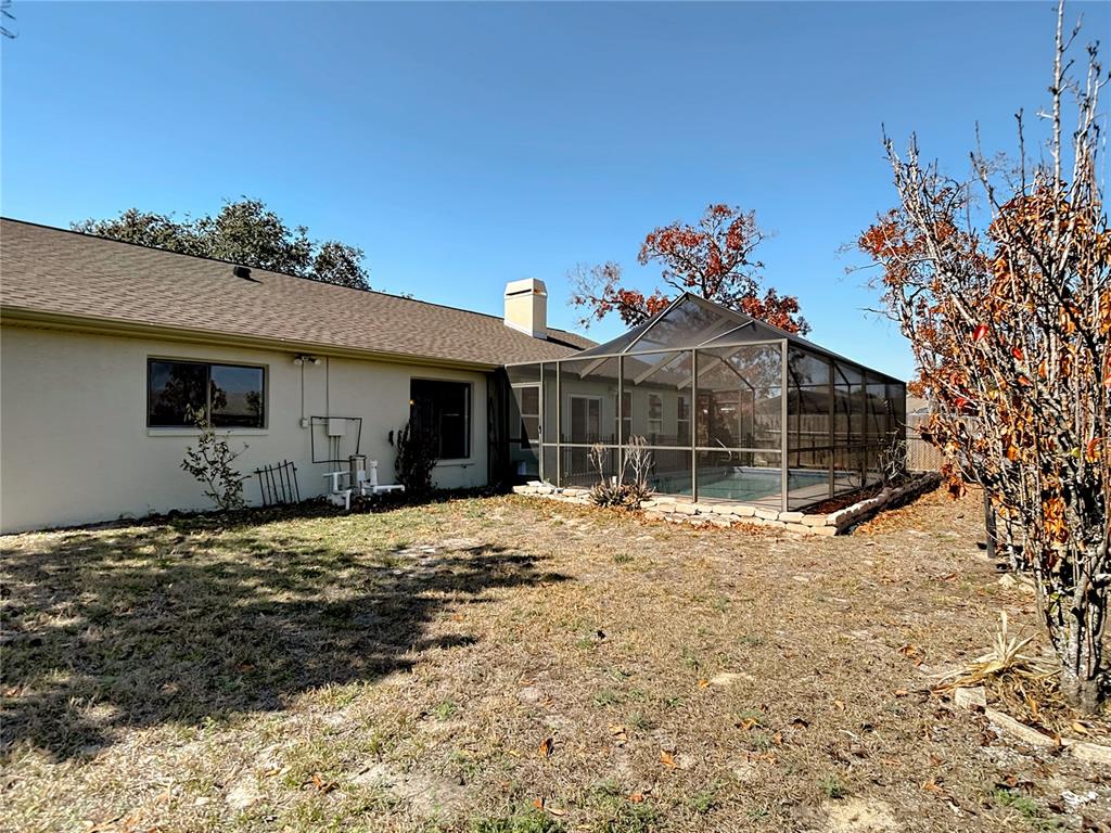 5066 Woodbine Street Spring Hill, FL 34608 - Photo 55 of 59 a view of a house with a snow