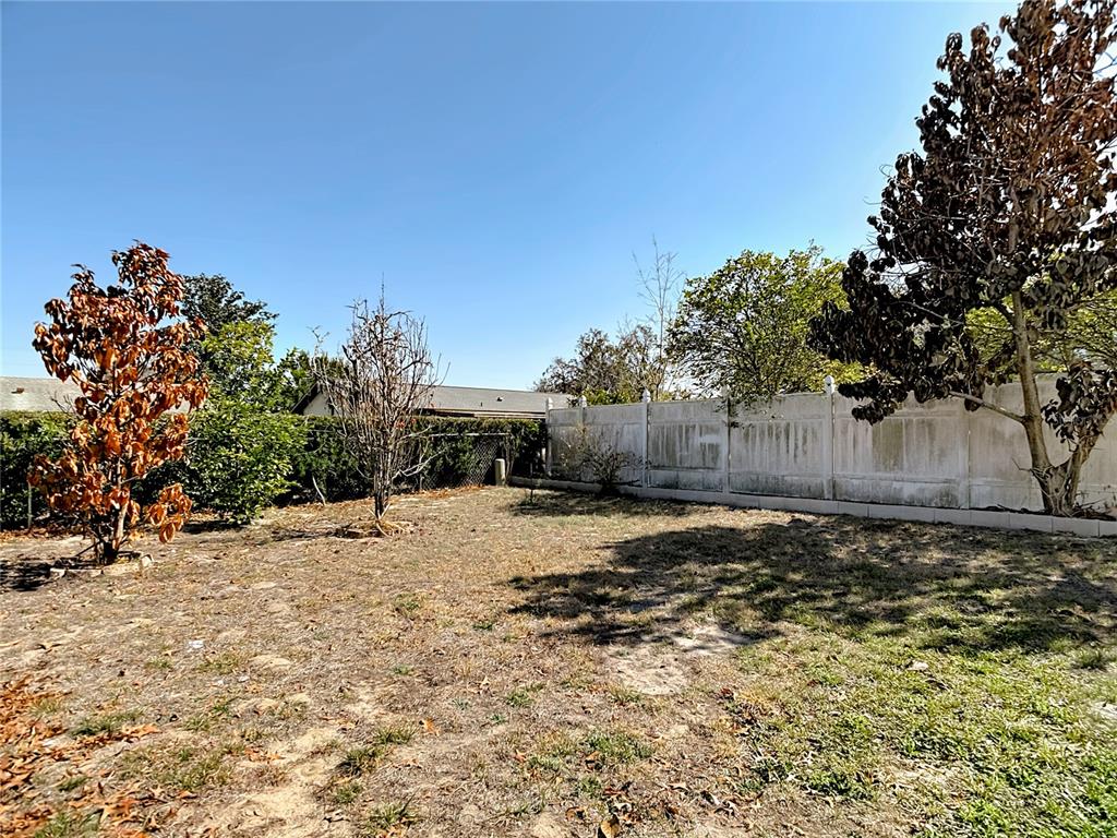 5066 Woodbine Street Spring Hill, FL 34608 - Photo 57 of 59 a street view with a yard