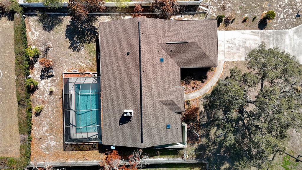 5066 Woodbine Street Spring Hill, FL 34608 - Photo 59 of 59 an aerial view of a house with a yard