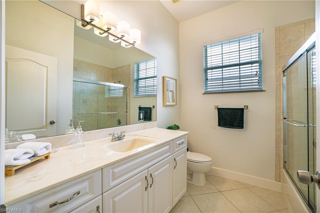 5235 Malvern Court Naples, FL 34112 - Photo 20 of 28 a bathroom with a sink a toilet and shower
