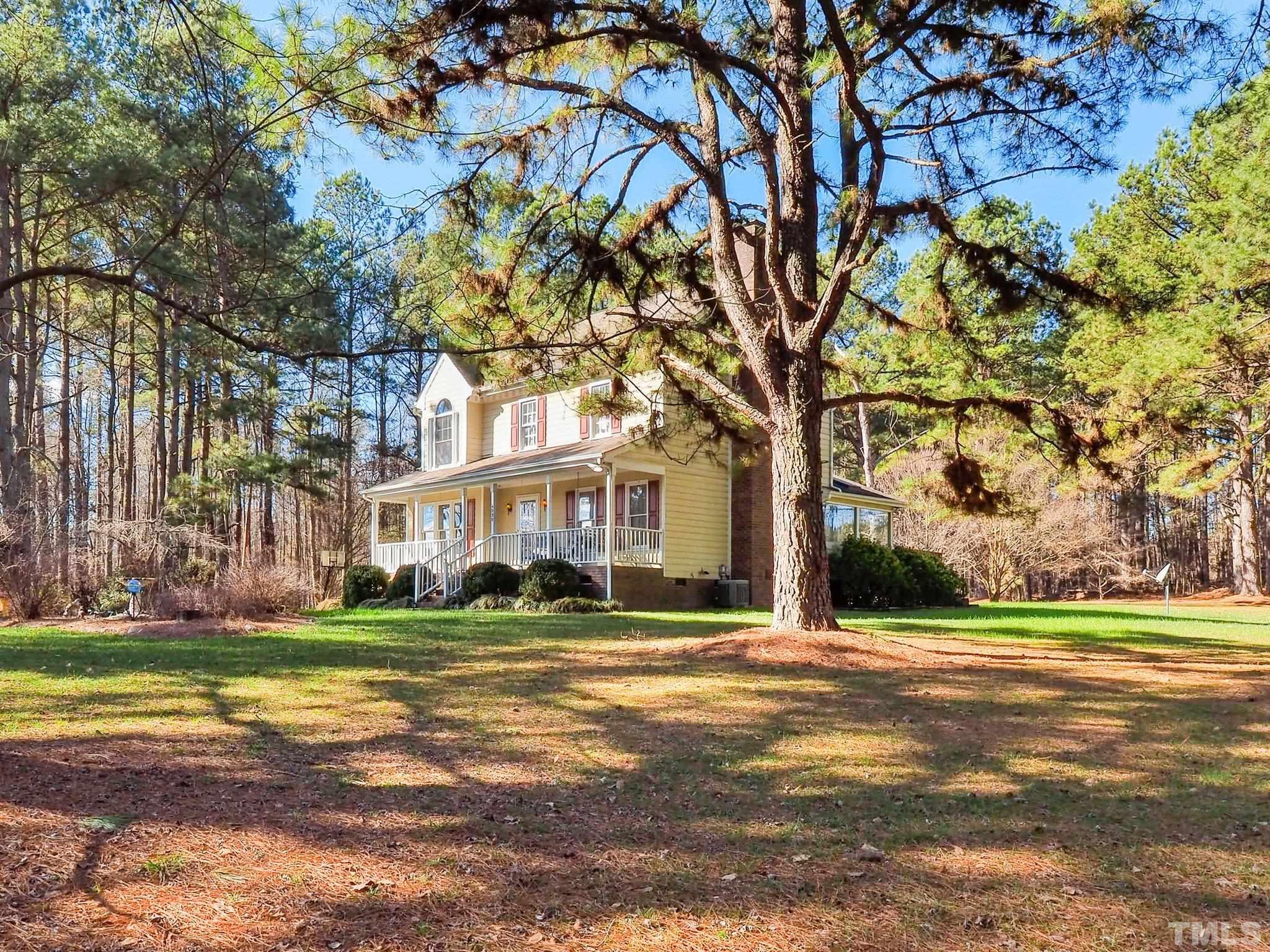 6030 Forestville Road Raleigh, NC 27604 - Photo 2 of 15 a front view of a building with a yard