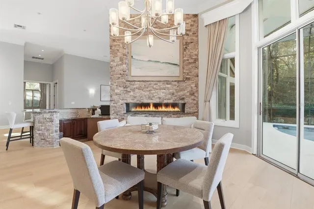 a view of a dining room with furniture and a window