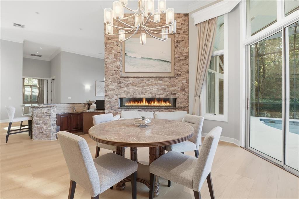 3255 North Pinelake Village Point Lecanto, FL 34461 - Photo 11 of 69 a view of a dining room with furniture and a chandelier
