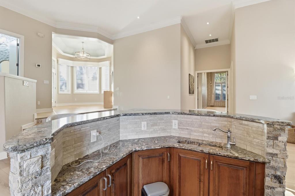 3255 North Pinelake Village Point Lecanto, FL 34461 - Photo 14 of 69 a bathroom with a granite countertop double vanity sink and mirror