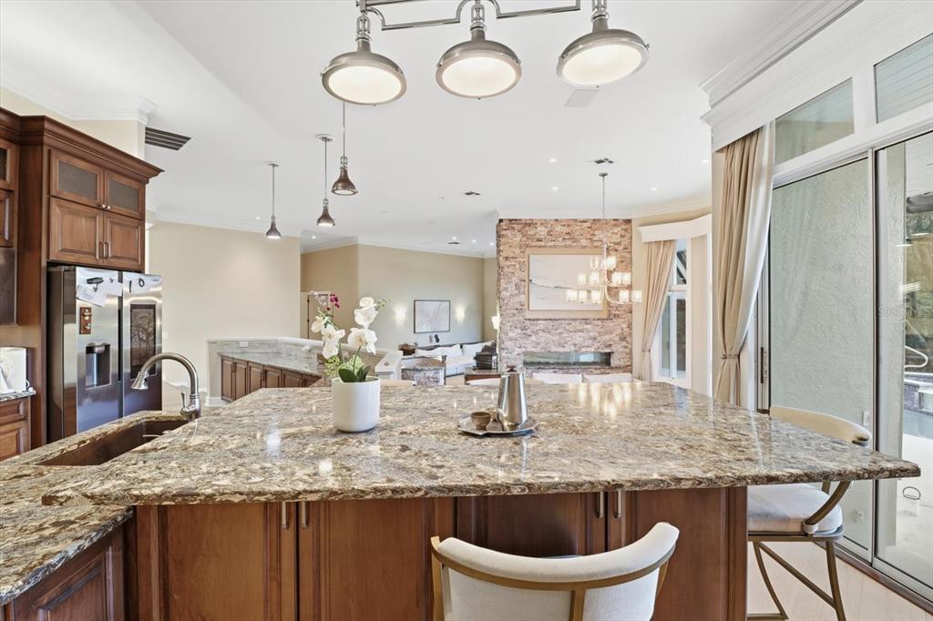 3255 North Pinelake Village Point Lecanto, FL 34461 - Photo 16 of 69 a kitchen with center island table and chairs