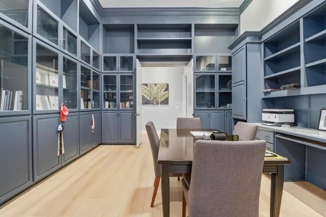 an aerial view of residential houses with outdoor space and a lake view