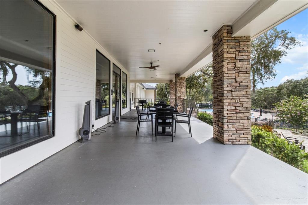3255 North Pinelake Village Point Lecanto, FL 34461 - Photo 60 of 69 a dining room with furniture and a garden