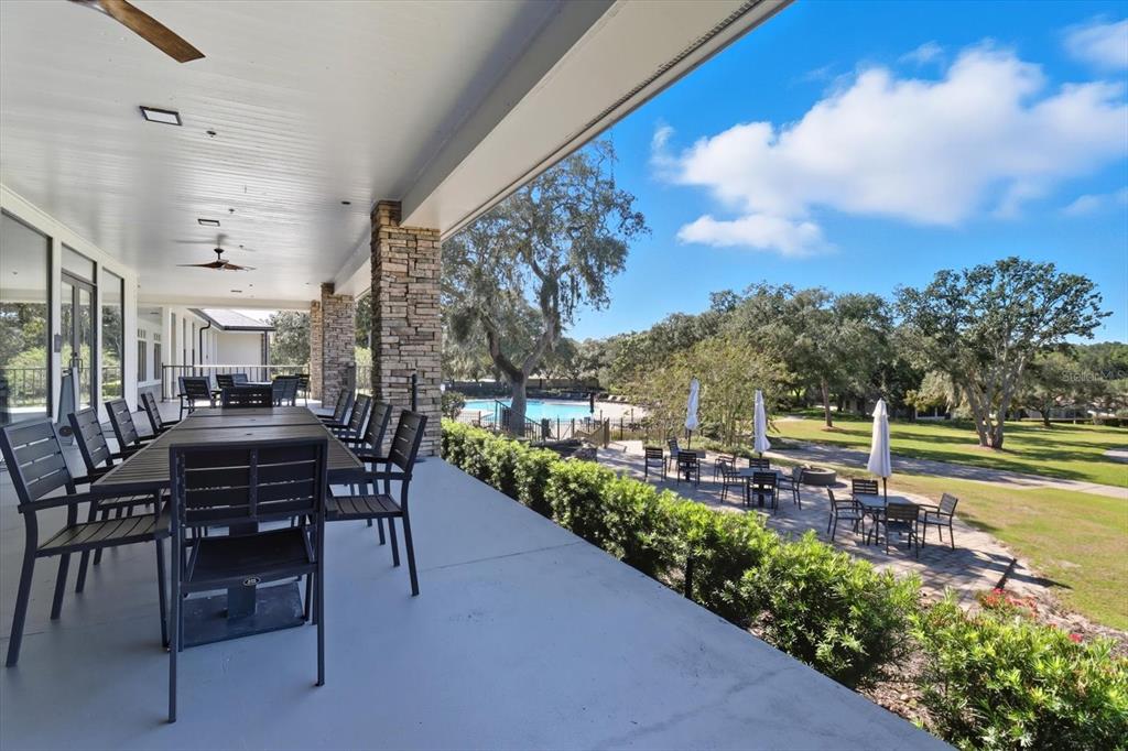 3255 North Pinelake Village Point Lecanto, FL 34461 - Photo 61 of 69 a view of a patio with a table and chairs