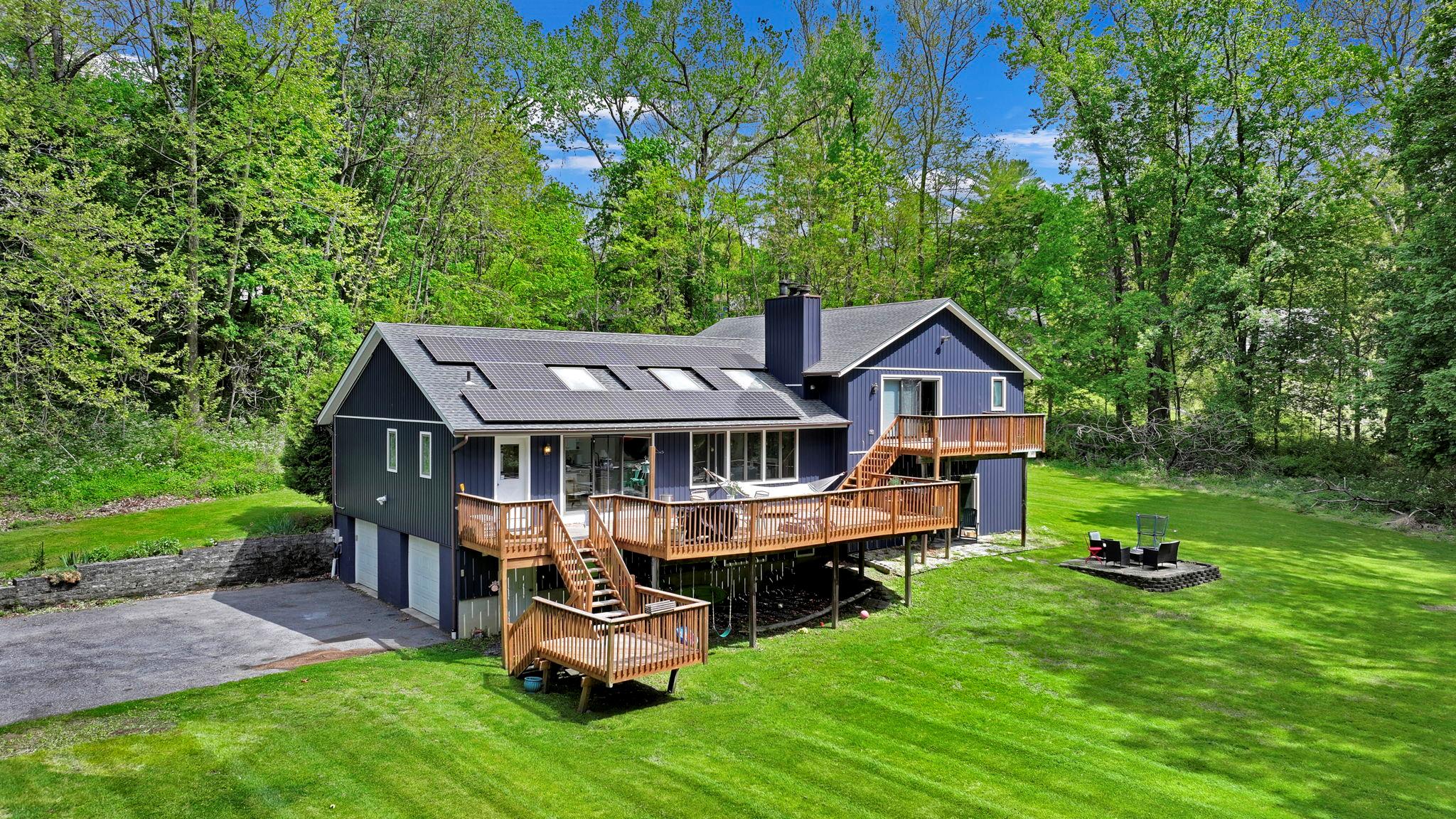 a front view of a house with garden