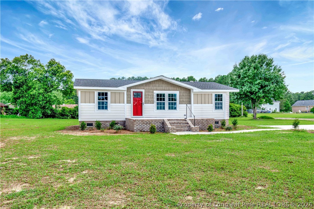7225 Deep Branch Road Pembroke, NC 28372 - Photo 2 of 27 a view of a house with a yard and sitting area