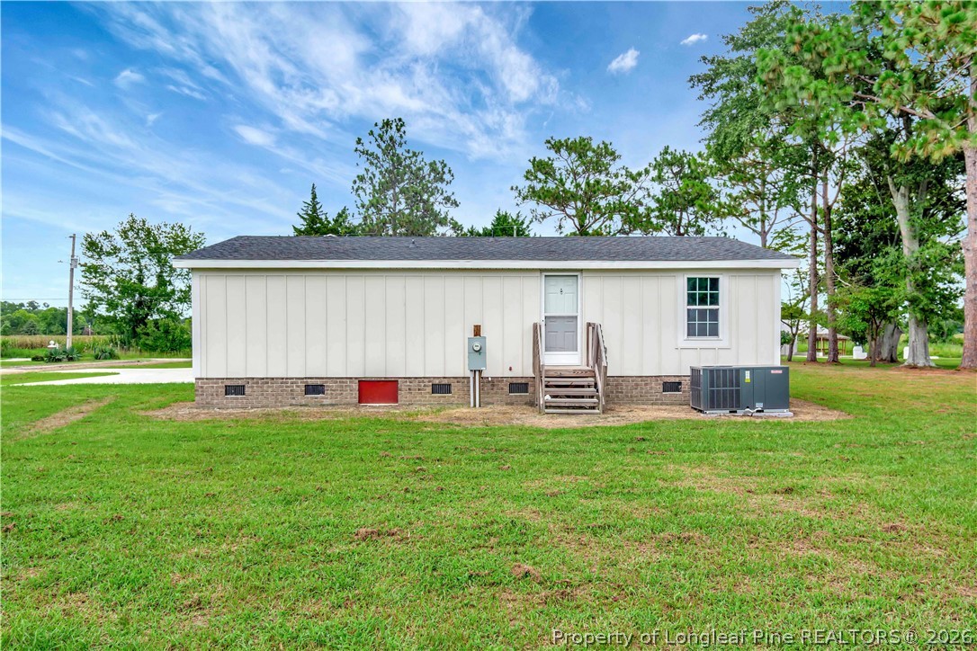 7225 Deep Branch Road Pembroke, NC 28372 - Photo 23 of 27 a view of a house with backyard and sitting area