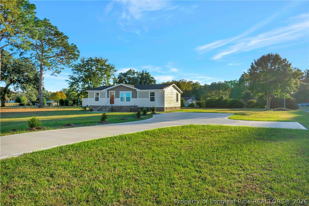 7225 Deep Branch Road Pembroke, NC 28372 - Photo 27 of 27 a view of house with a swimming pool