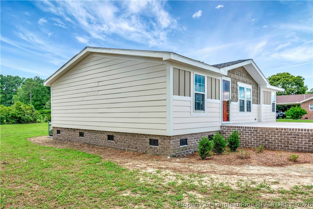 7225 Deep Branch Road Pembroke, NC 28372 - Photo 4 of 27 a backyard of a house with lots of green space