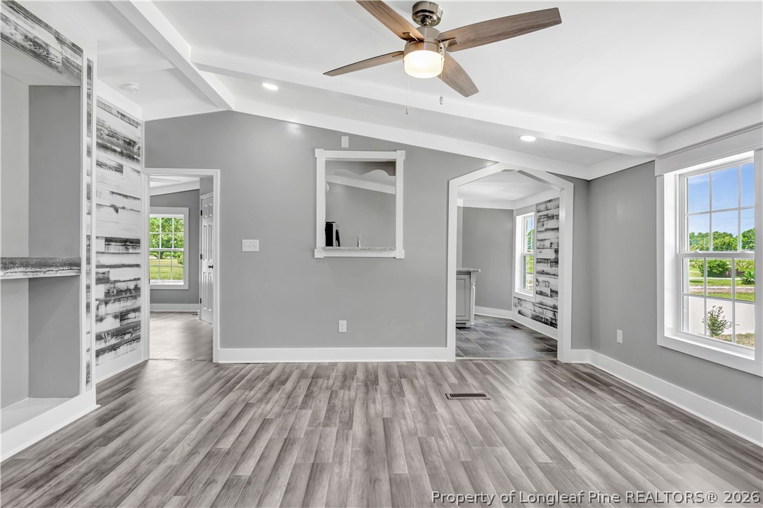 7225 Deep Branch Road Pembroke, NC 28372 - Photo 6 of 27 wooden floor in an empty room with a window