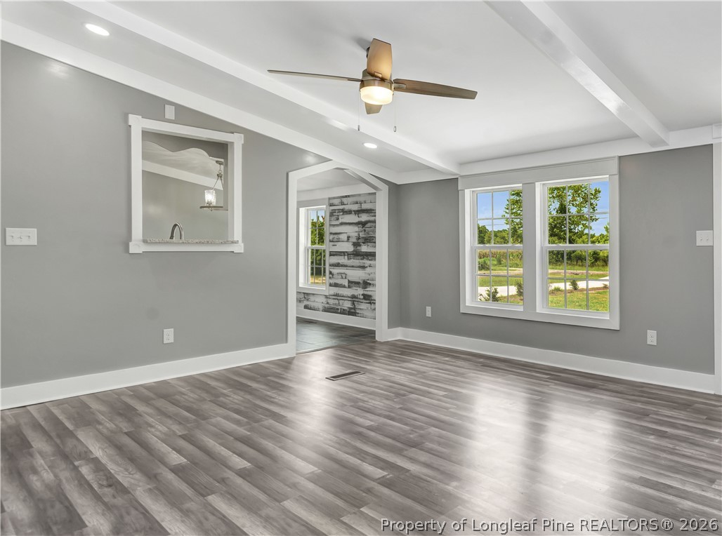 7225 Deep Branch Road Pembroke, NC 28372 - Photo 7 of 27 wooden floor in an empty room with a window