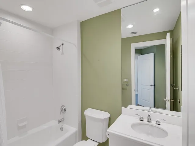 a bathroom with a toilet a sink and a bathtub
