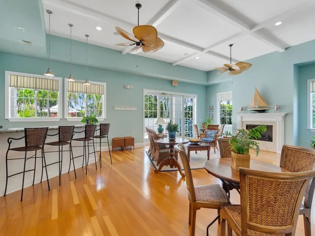 a living room with fireplace furniture and a wooden floor