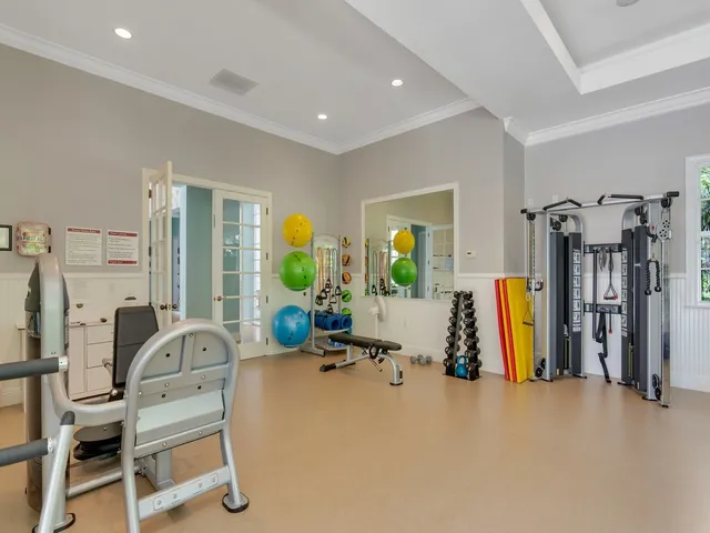 a view of a livingroom with furniture and a large window