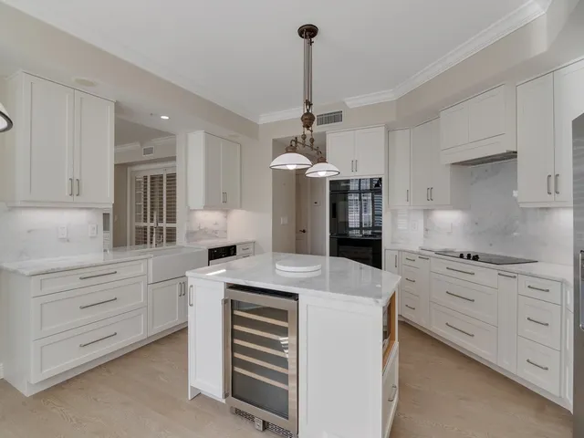 a kitchen with granite countertop cabinets and stainless steel appliances