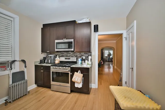 a kitchen with a refrigerator stove and a sink