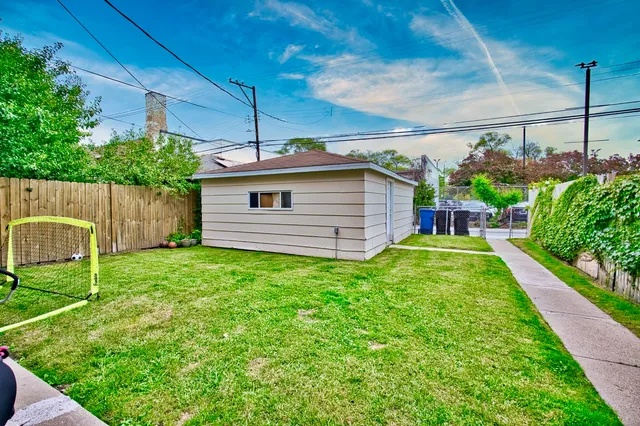 a view of a backyard with plants and a garden